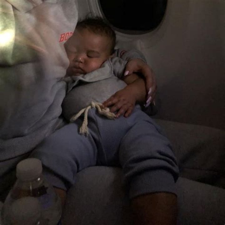Iggy Azalea’s Son Onyx, 7 Months, Sleeps In Her Arms While On A Plane In Rare Photo: ‘Beautiful Boy’