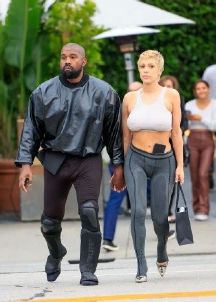Kanye West’s Wife Bianca Censori Wears Cheeky White Bodysuit & Thigh-High Boots