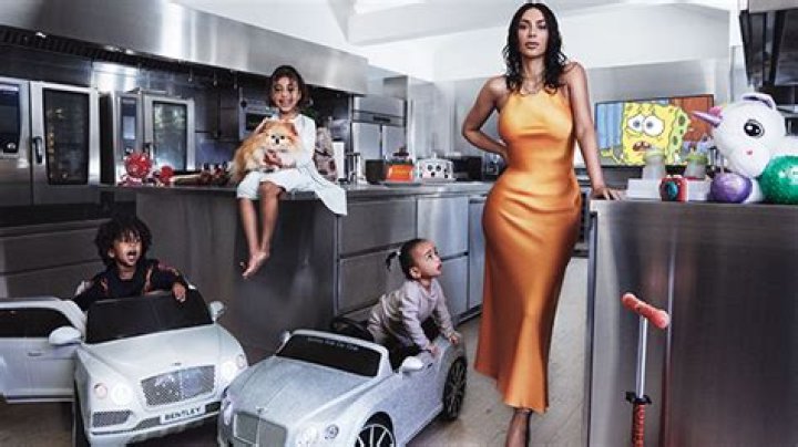 Kim Kardashian Proves She’s The Sexiest Mom Ever In Family Photo For New ‘VOGUE’ Cover
