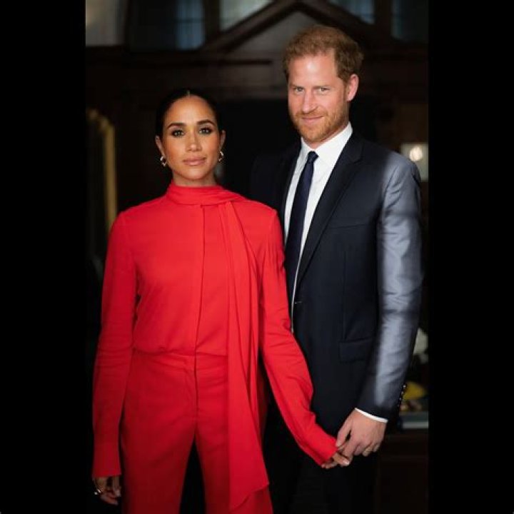 Meghan Markle & Prince Harry Hold Hands In Rare PDA Moment In Cape Town